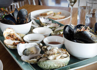 Local Tasmanian seafood and fish – Hobart, Tasmania A spread of local Tasmanian oysters and shellfish from Bangor Wine and Oyster Shed in Hobart, Tasmania.