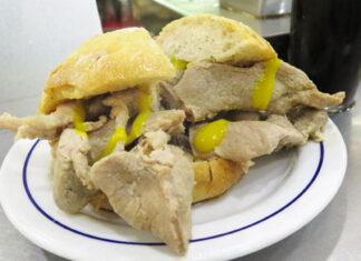 Bifana sandwich – Lisbon, Portugal A pork bifana sandwich with yellow mustard from a cafe in Lisbon.