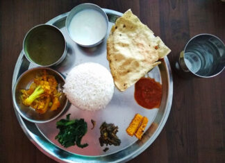 Dal bhat – Kathmandu, Nepal Dal bhat, a thali-style dish in Kathmandu, Nepal, that places lentil dal, a curry, pickles, and a papad around a mound of rice.