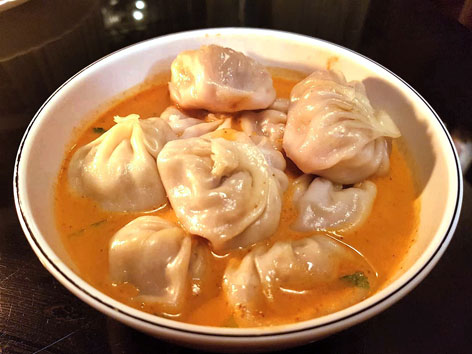 A bowl of momo jhol achar, or momo dumplings in soup, from Kathmandu