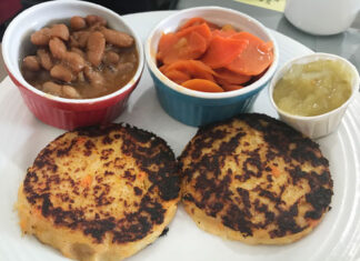 Acadian fish cakes in Nova Scotia Acadian fish cakes with baked beans, chow-chow, and carrots in Nova Scotia.