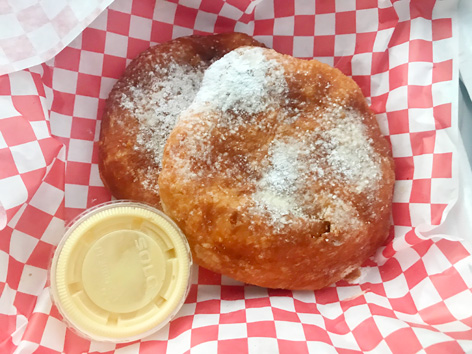 A classic Utah scone, deep-fried dough dusted in sugar, with a side of honey butter. 